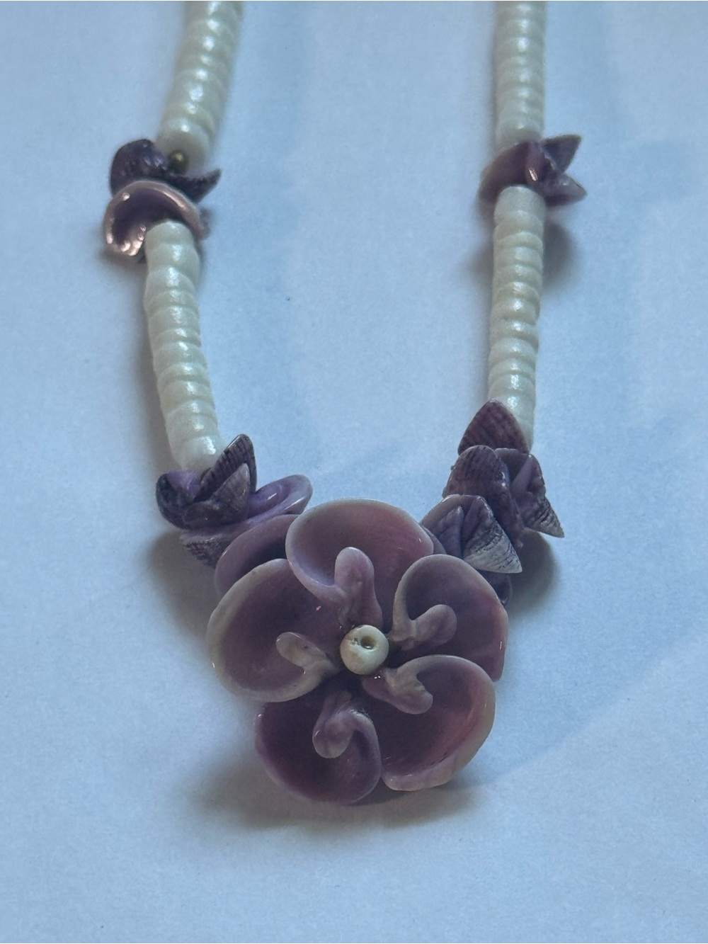 Natural purple clam shell necklace. No chips or cracks in flower